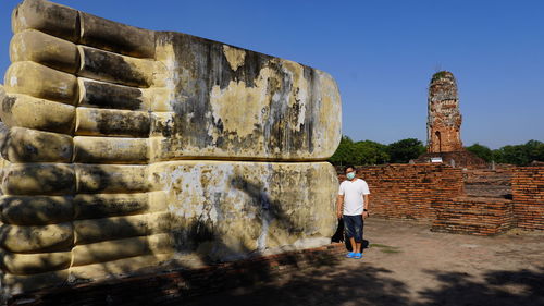 Full length rear view of man against sky