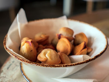 The baked tortellini served in a bowl on baking paper in a rustic style.