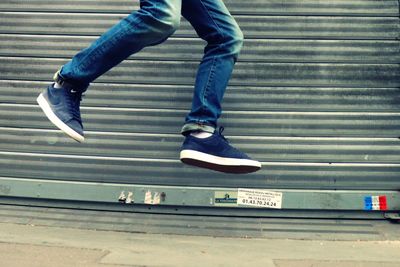 Low section of man skateboarding