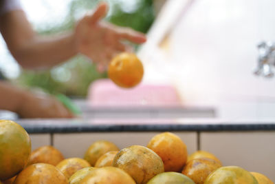 Close-up of orange fruits on cutting board