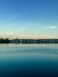 Scenic view of river against blue sky