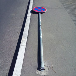 High angle view of road sign on street