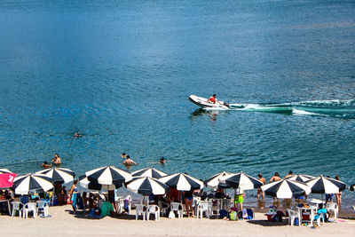 High angle view of people enjoying at seaside