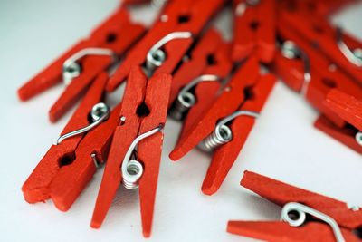 High angle view of red clothes pins 