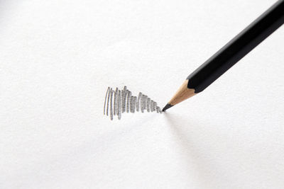 High angle view of pencils against white background