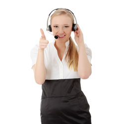 Portrait of a smiling young woman against white background