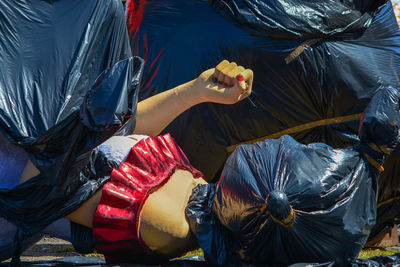 Sculptures in plastic bags on road