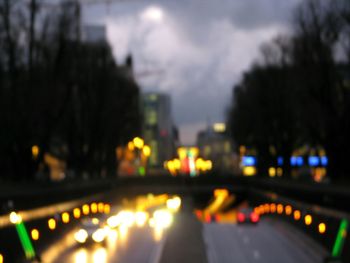 Defocused image of illuminated city at night