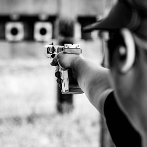 Woman shooting with gun