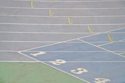 High angle view of running track with numbers in stadium