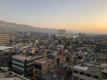 High angle view of townscape against sky during sunset