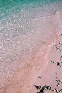 High angle view of wet sand on beach