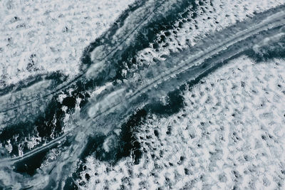 High angle view of people on snow covered land