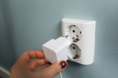 Woman holding plug