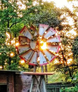 Low angle view of illuminated ferris wheel in park