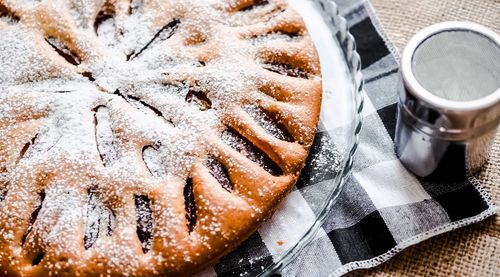 Homemade cake with powdered sugar on the table