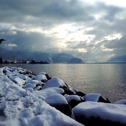 Scenic view of sea against cloudy sky