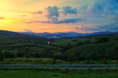 Scenic view of landscape against sky during sunset