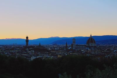 City against sky during sunset