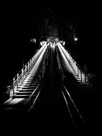 Illuminated footbridge at night