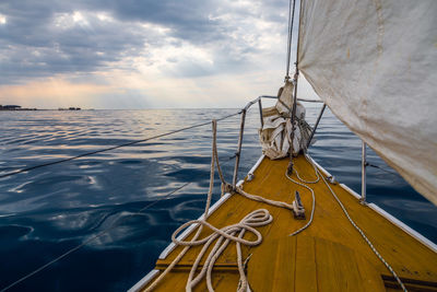 Sailboat sailing on sea against sky