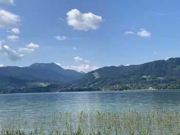 Scenic view of lake and mountains against sky