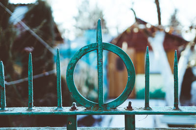 Close-up of metal fence against blurred background