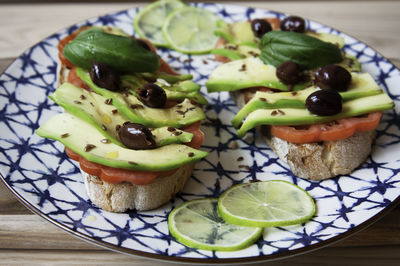 High angle view of fruits in plate on table