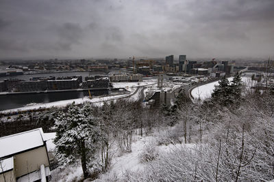 High angle view of buildings in city during winter