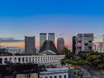 Modern buildings against sky in city