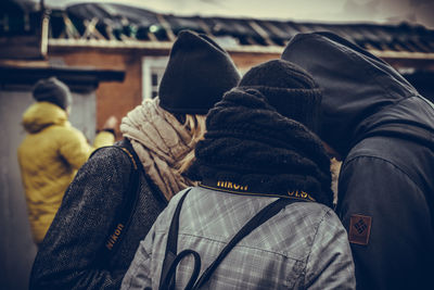 Close-up of friends in warm clothing outdoors