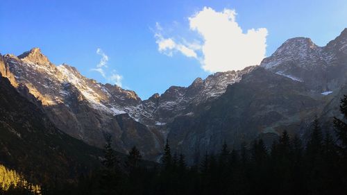 Panoramic view of snowcapped mountains against sky