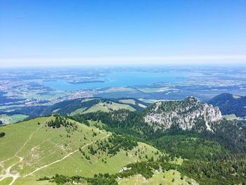 Scenic view of landscape against blue sky