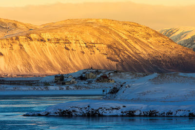 Scenic view of snowcapped mountains against sky during winter