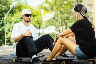 Young couple sitting in park