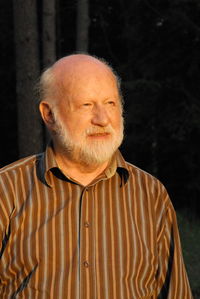 Man looking away while standing outdoors