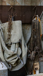 Close-up of old clothes hanging on wall