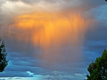 Low angle view of dramatic sky during sunset