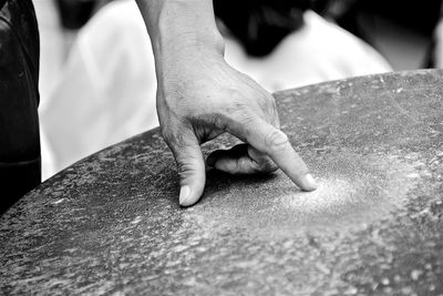 Close-up of hands working on table