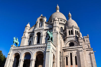 Low angle view of cathedral against clear blue sky