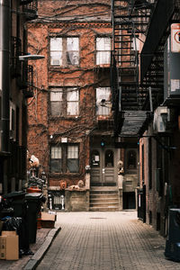 Alley amidst buildings in city