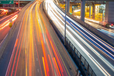 High angle view of light trails on highway at night