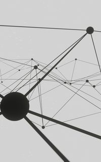 Low angle view of electricity pylon against sky