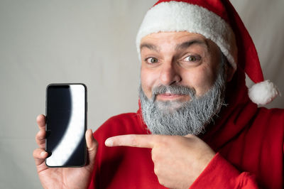 Portrait of mature man using mobile phone