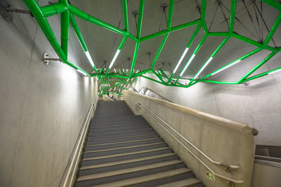 Low angle view of illuminated staircase in tunnel
