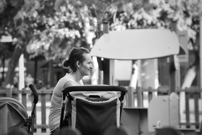 Young woman looking down outdoors