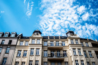 Low angle view of buildings against blue sky