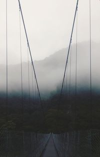 Scenic view of mountains against cloudy sky