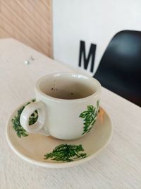 Close-up of tea cup on wooden table
