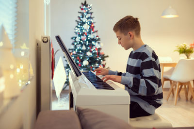 Boy using laptop at home